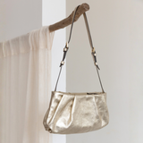 Isola Handbag: Gold Leather